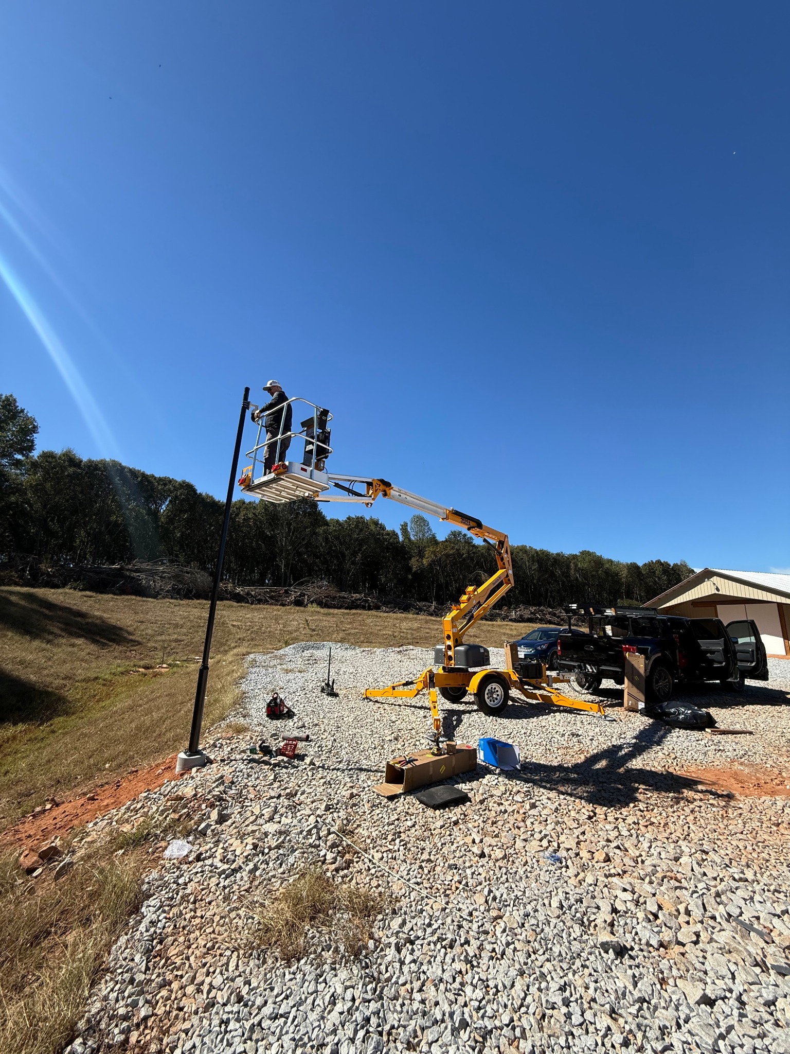Lift-supported installation of commercial camera pole
